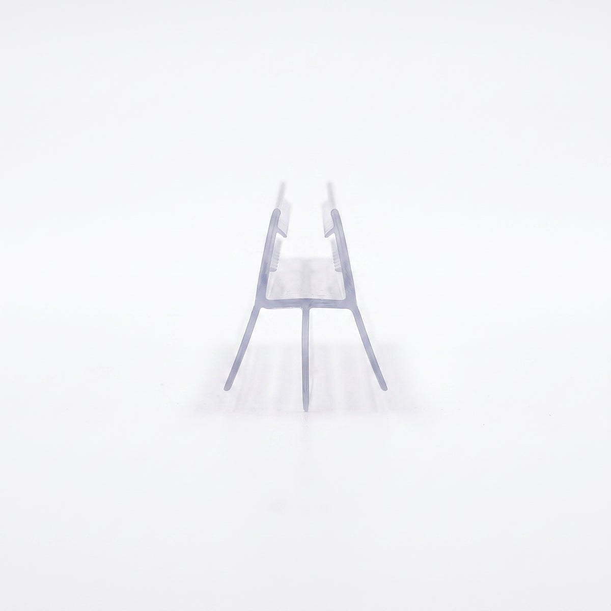 Clear seal offcut end-on on white, glass channel on two splayed legs with a centre fin between