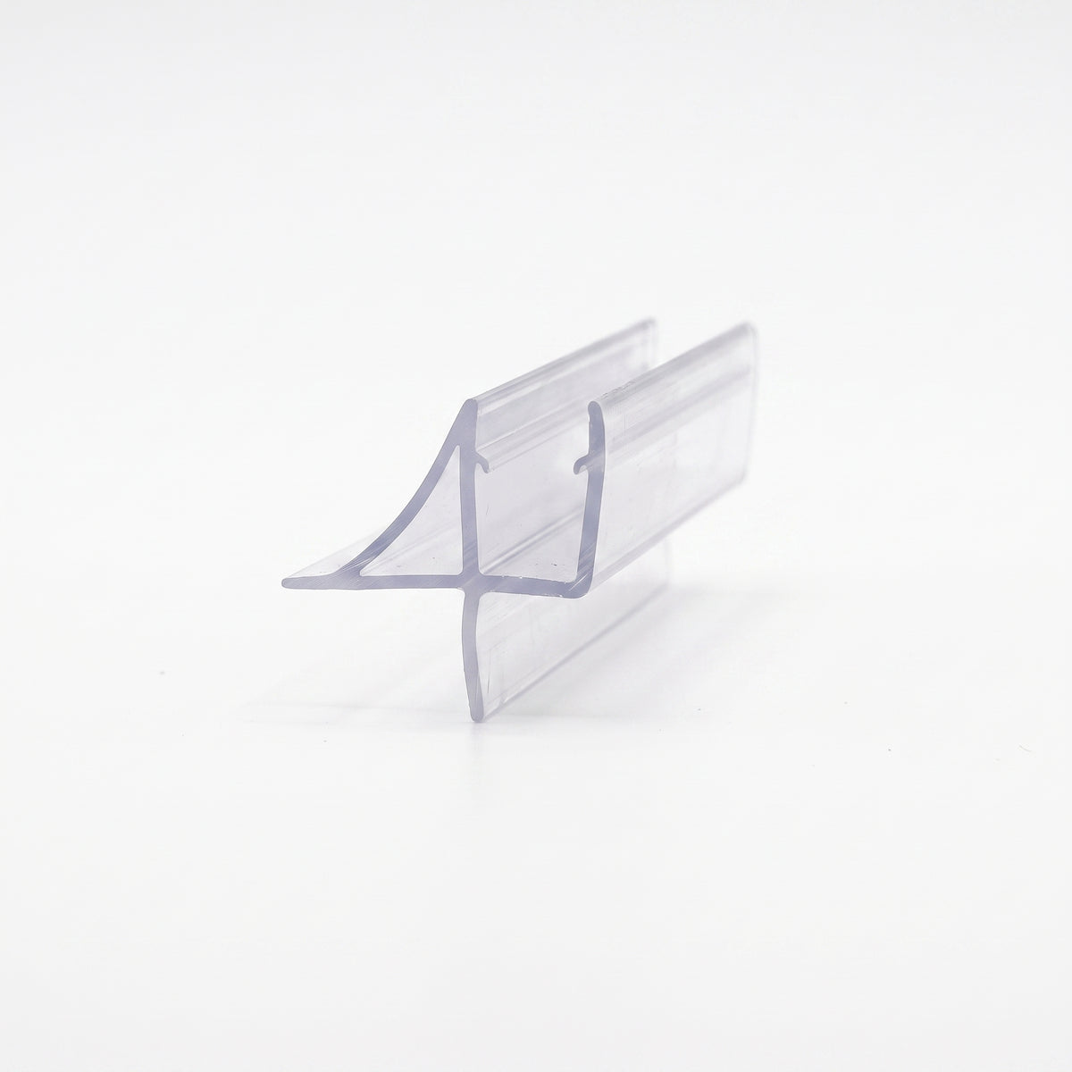 Clear seal offcut on white, glass channel with a swept wing fin and a straight blade below