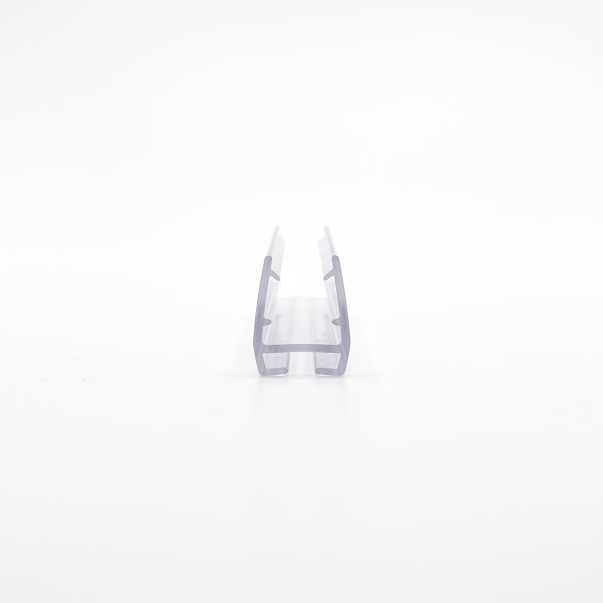 Clear carrier seal offcut end-on on white, push-on glass channel with a grooved slot below