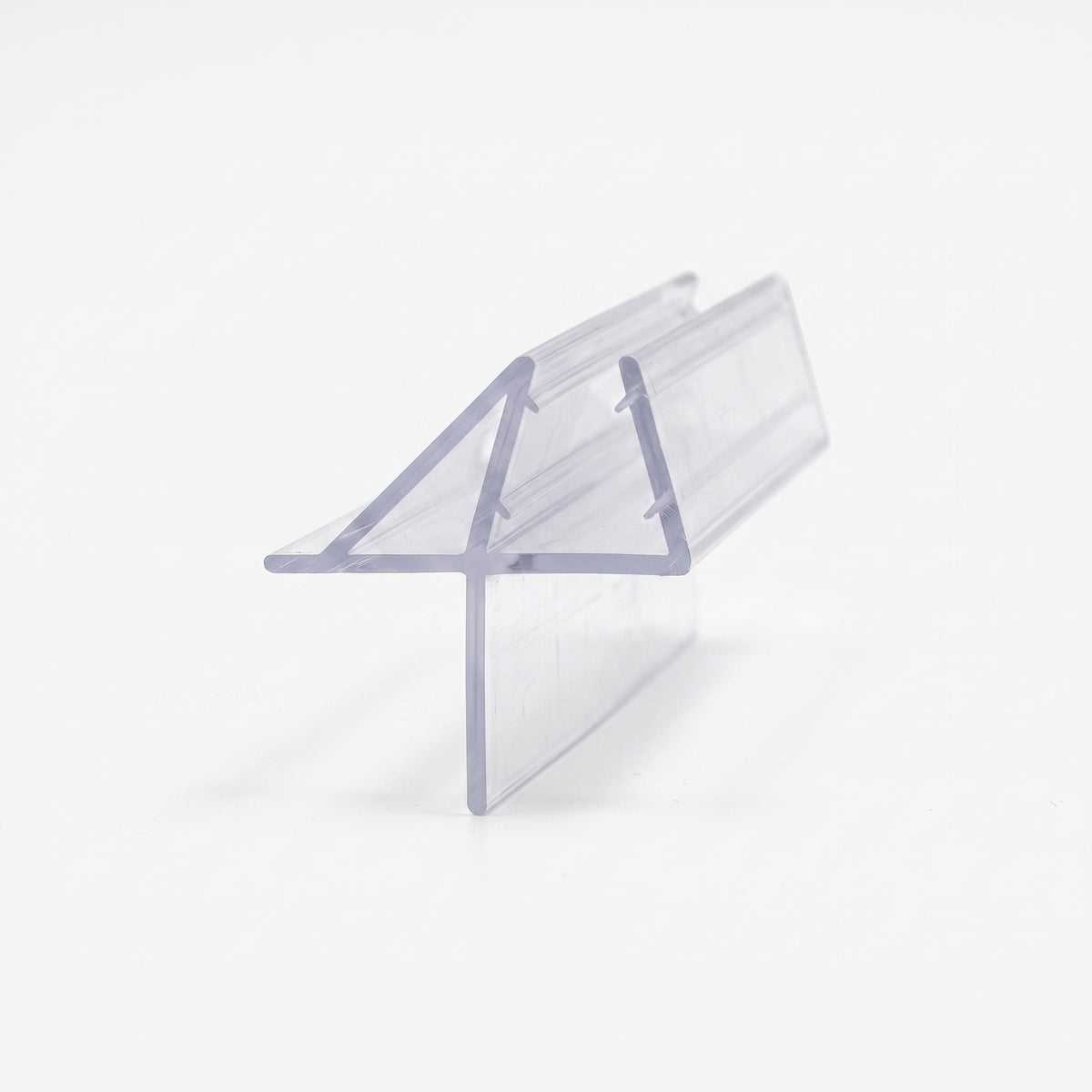 Clear seal offcut on white, glass channel with a triangular wing fin and a flat foot blade below