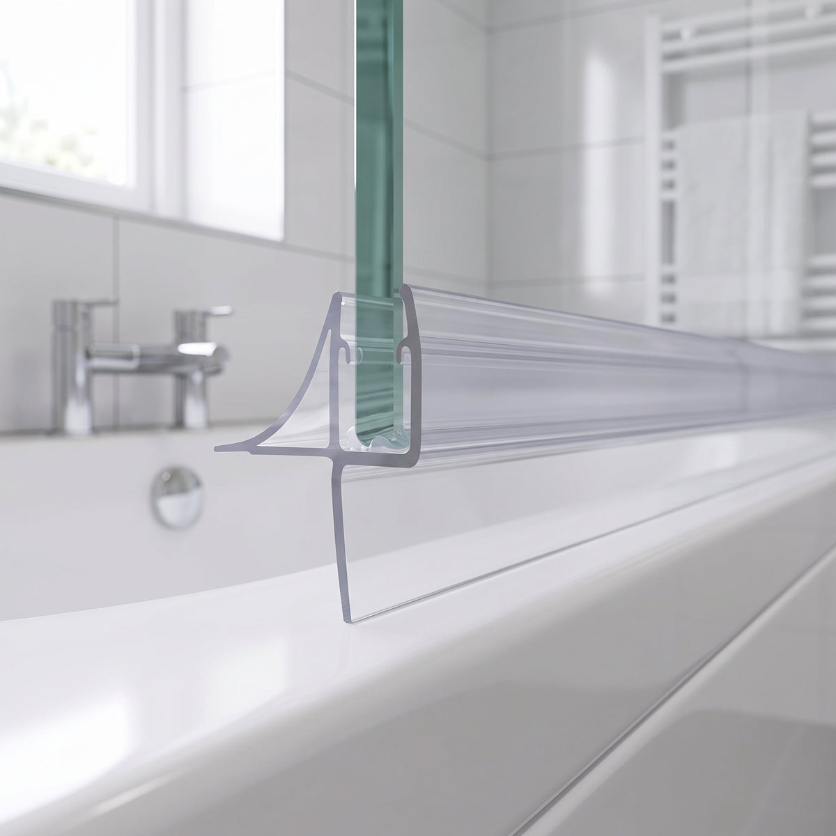 Clear seal on the bottom edge of a bath screen, blade sweeping across the white bath rim