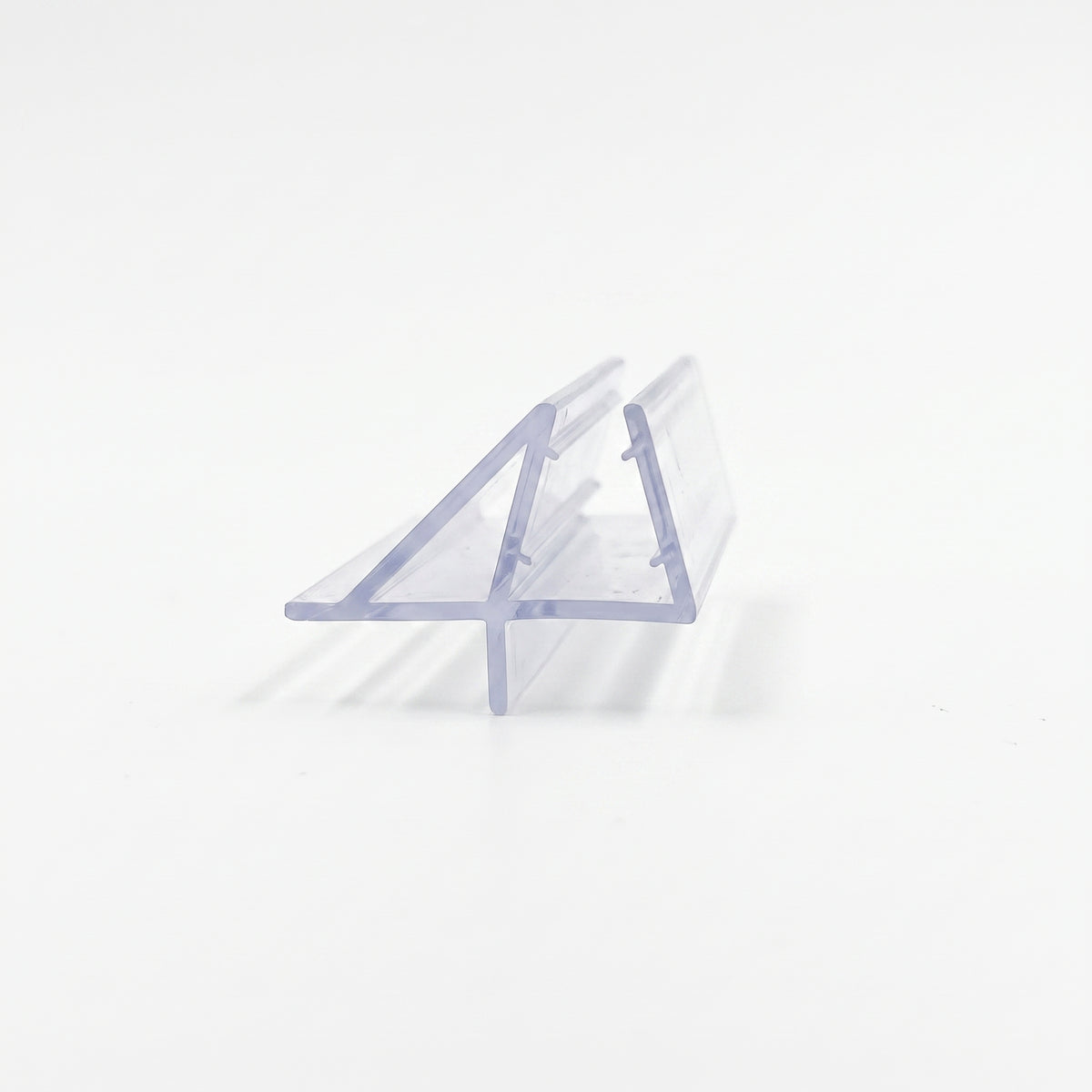 Clear seal offcut on white, slim glass channel with an angled wing fin and a short lower blade