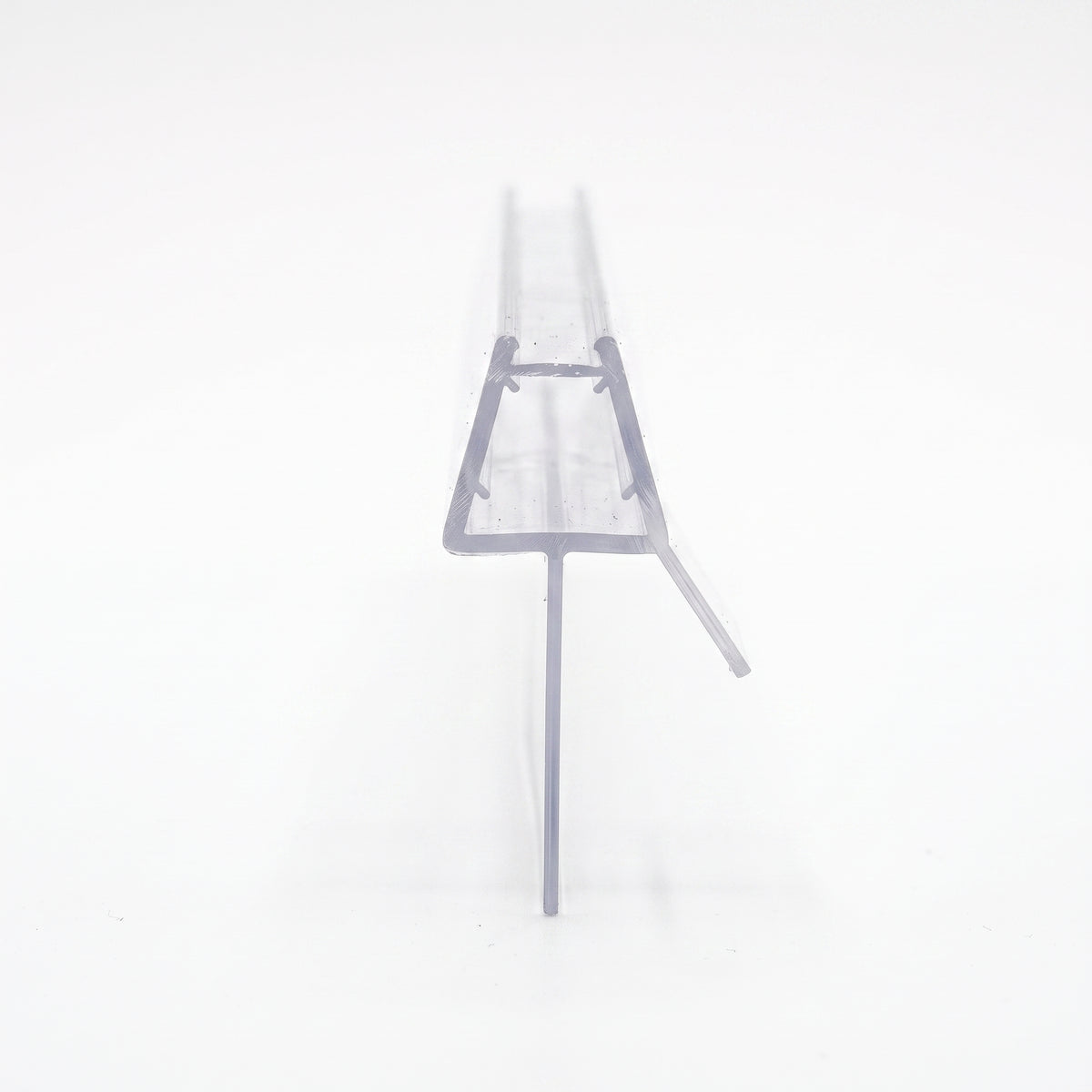 Clear seal offcut end-on on white, trapezoid glass channel with an angled fin and a long drop fin