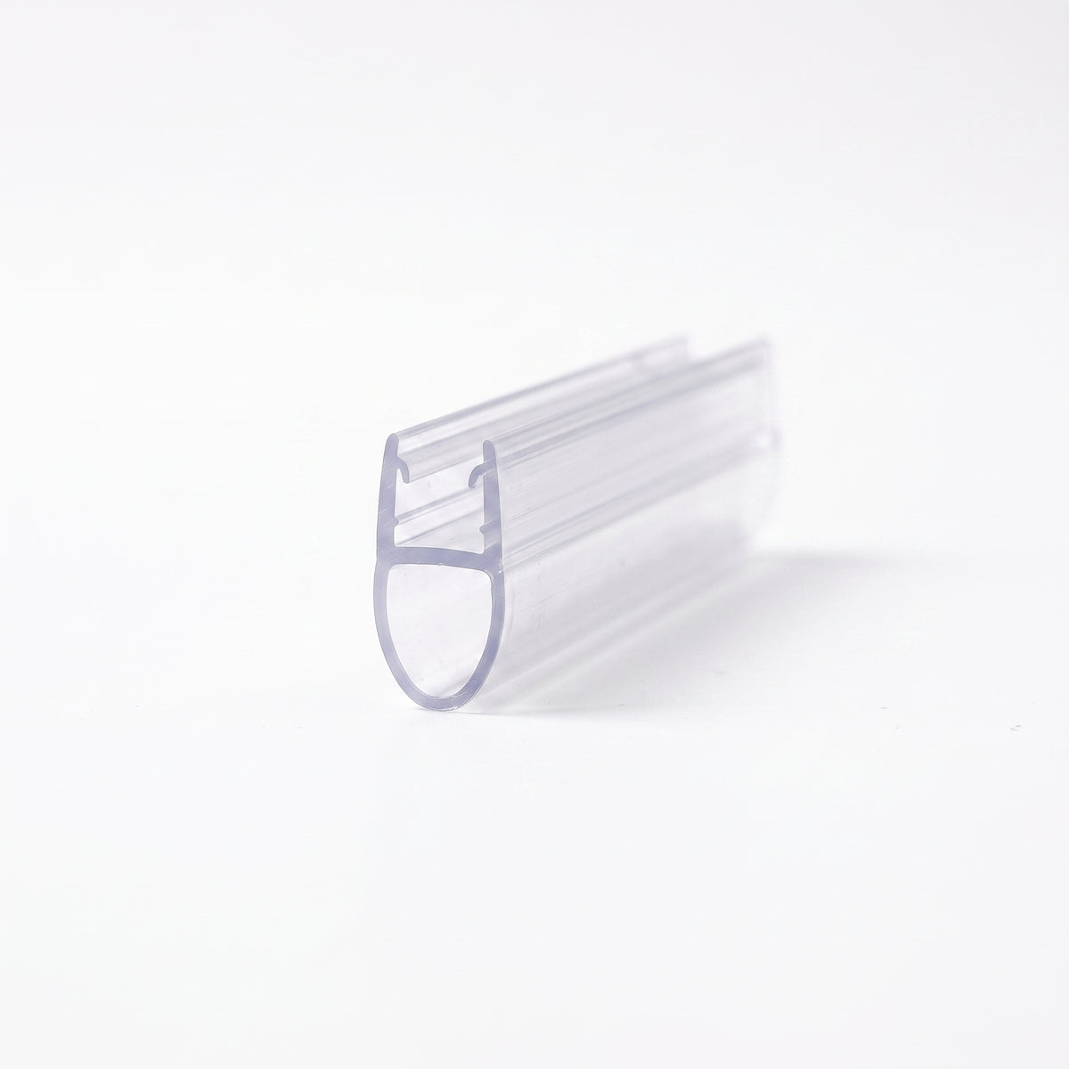 Clear seal offcut on white at an angle, glass channel above a long hollow teardrop bubble
