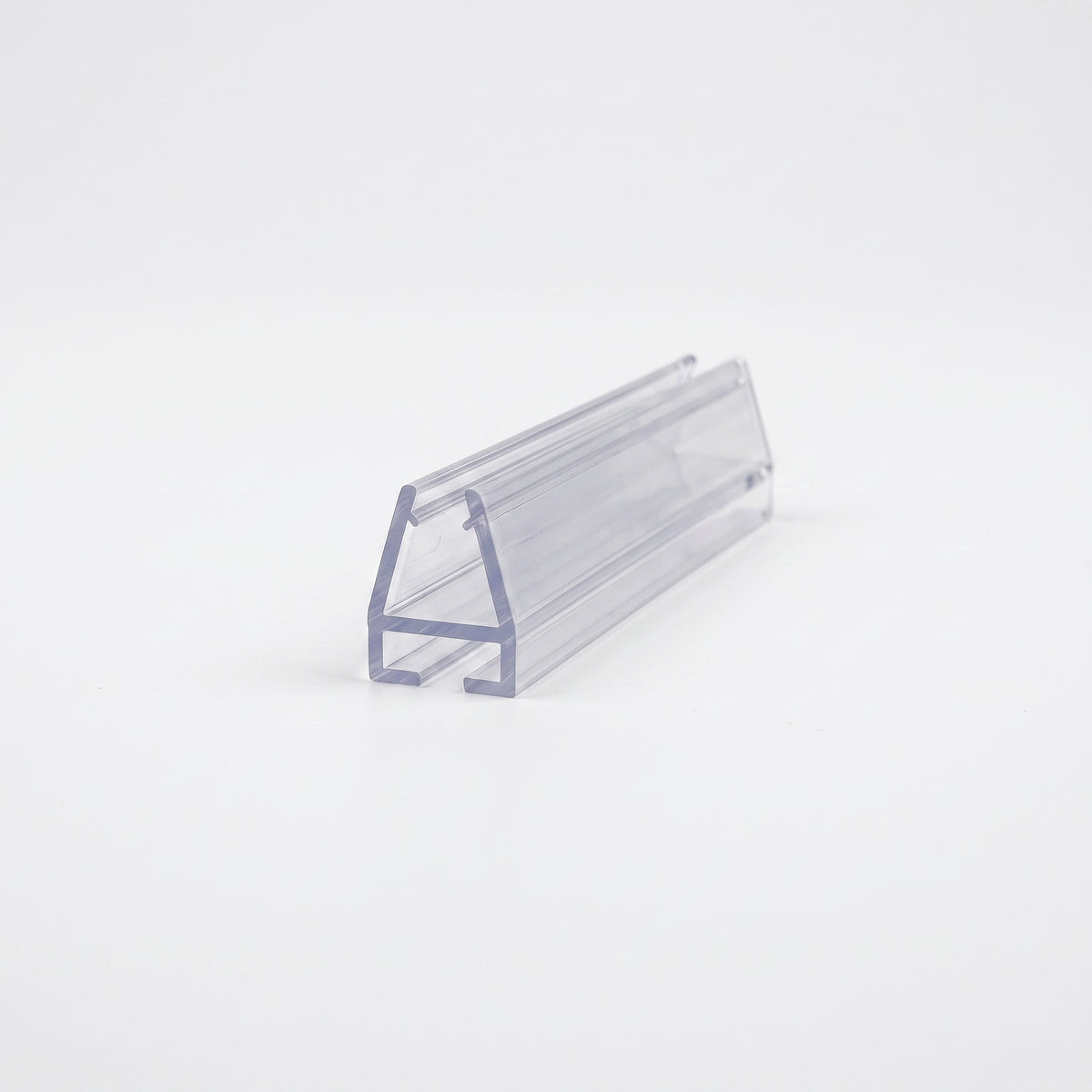 Clear seal offcut angled on white, tapered glass channel raised on a flat base foot