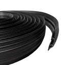 Coiled black rubber cable cover with its cut end showing the internal cable channel