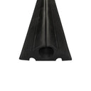 Angled end-on view of the ribbed black protector showing the circular cable bore and notched base