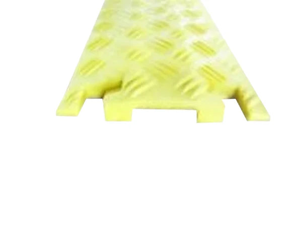 End-on view of the low-profile yellow protector strip, chequer tread on top and two cable channels beneath