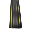 Top-down view of the black rubber protector strip with two yellow stripes running the length of the ribbed top