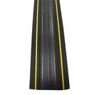 Top-down view of the black rubber protector strip with two yellow stripes running the length of the ribbed top