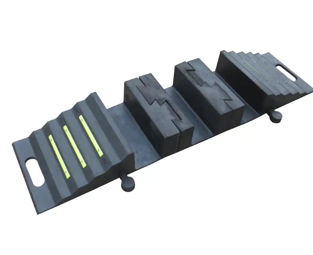Angled view of the assembled modular ramp: ribbed end section with three lime green strips, centre blocks and second end