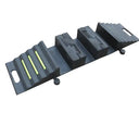 Angled view of the assembled modular ramp: ribbed end section with three lime green strips, centre blocks and second end