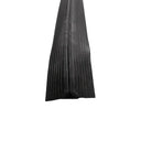 Black ribbed rubber floor cable protector running lengthways, low-profile with tapered edges