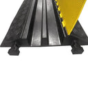 Close-up of a two-channel cable ramp with its yellow chequer-plate lid raised