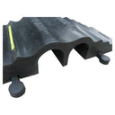 End-on close-up of the two-channel black rubber protector showing both arched cable channels and side tab