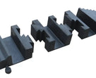 Close-up along the row of black centre blocks, showing the zig-zag interlocking teeth between sections