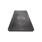 Flat black rubber dock bumper pad, front-on view showing its smooth tapered face