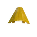 Head-on view of a yellow cable cover ramp with raised chevron tread running the full length