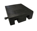 Angled view of the black rubber block section, finely ribbed top and two square notches cut in the side