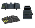Three views of the black moulded ramp on white: face-on with round pegs, an angled render, and one ribbed wing face-on