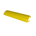 Yellow plastic cable cover viewed from above at an angle, with moulded tread pattern and end connectors