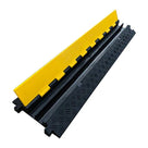 Angled view of the cable cover with its yellow hinged lid lifted open along the black chequer-tread base
