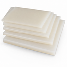 Five cream nylon sheets fanned in a stack on a white background, cut edges stepped