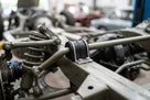 Anti-roll bar bush fitted in place on a vehicle's rear suspension chassis