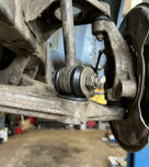 Link bush fitted to a front suspension arm on a vehicle