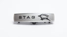 Brushed silver STAG side badge with black leaping stag emblem, studio shot