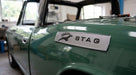 Silver STAG side badge fitted to the wing of a green Triumph Stag Mk1