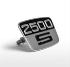 Silver and black 2500 S badge with rear fixing bolt, angled studio shot