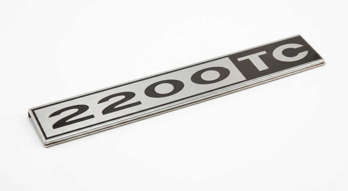 Chrome-edged 2200TC badge on a plain white background