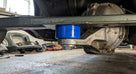 Blue polyurethane bush fitted between leaf spring and differential mounting underneath a car
