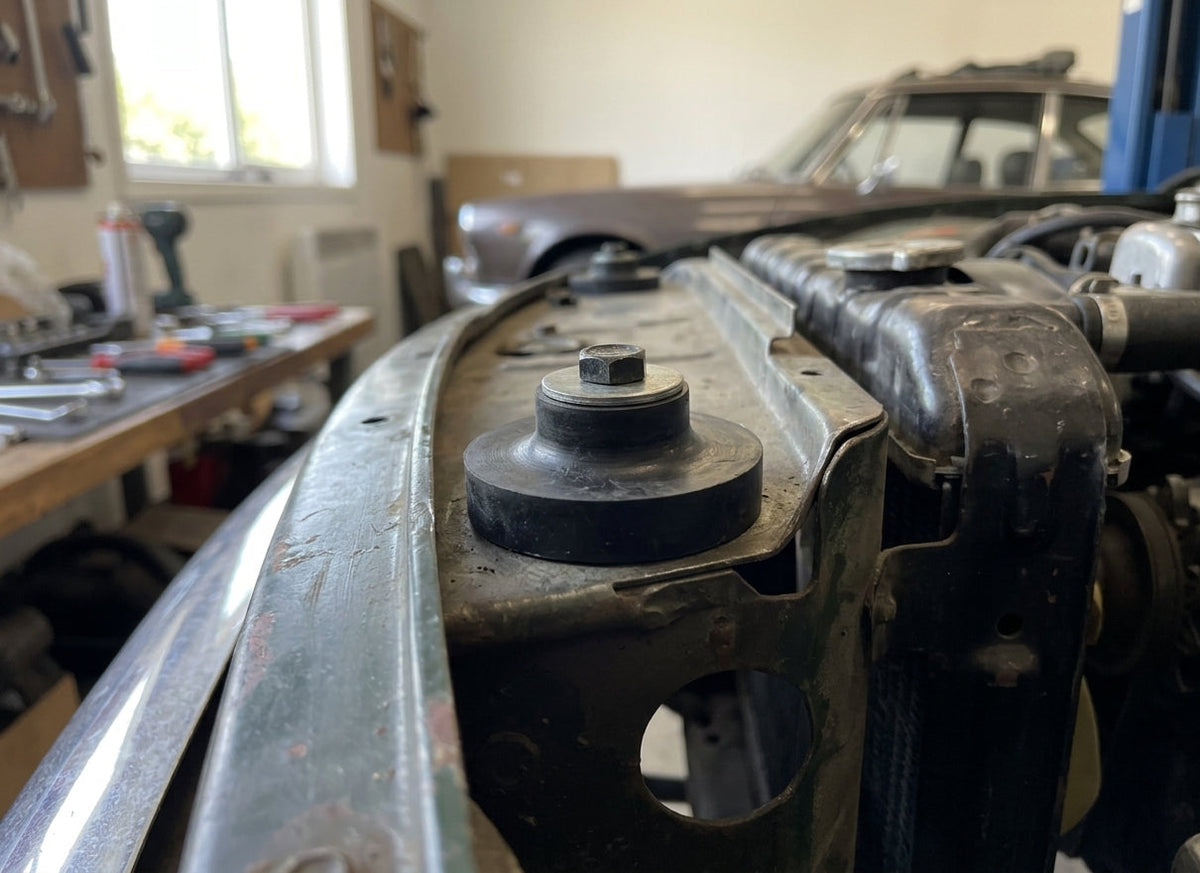 Mounting bush fitted in situ on the radiator support panel in an engine bay