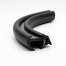 Black rubber window seal coiled, showing bulb and gripper channel profile