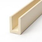 Cream PVC U-shaped edge trim profile shown at an angle on a white background