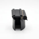 Black rubber window seal viewed end-on with cut length showing sponge bulb beside it