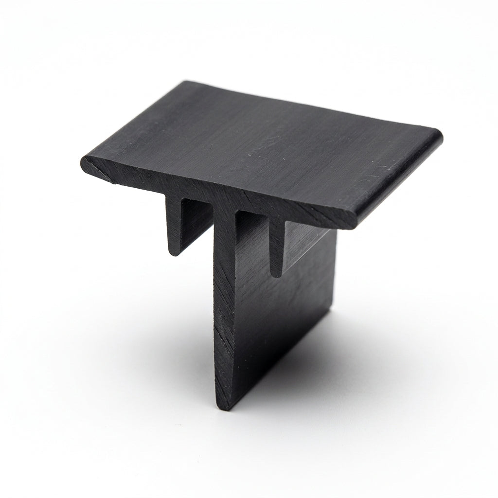 Black T-shaped corner section piece standing upright on white background