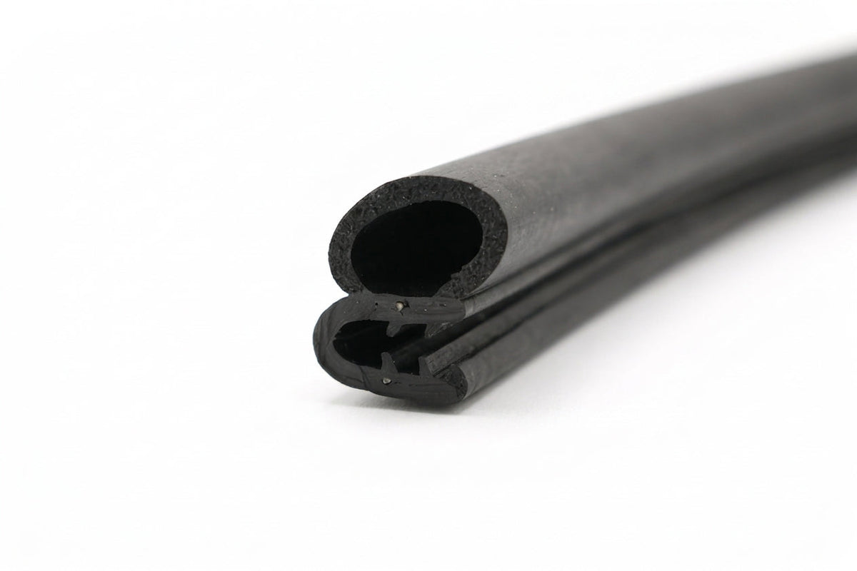 Coiled length of black self-grip rubber seal showing hollow bulb and sponge profile