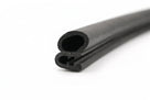 Coiled length of black self-grip rubber seal showing hollow bulb and sponge profile