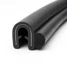 Curved length of black self grip side seal with smooth U-shaped metal insert and trailing sponge bulb