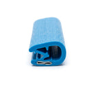 Cut length of blue textured PVC edging strip showing the metal grip clip at the open end