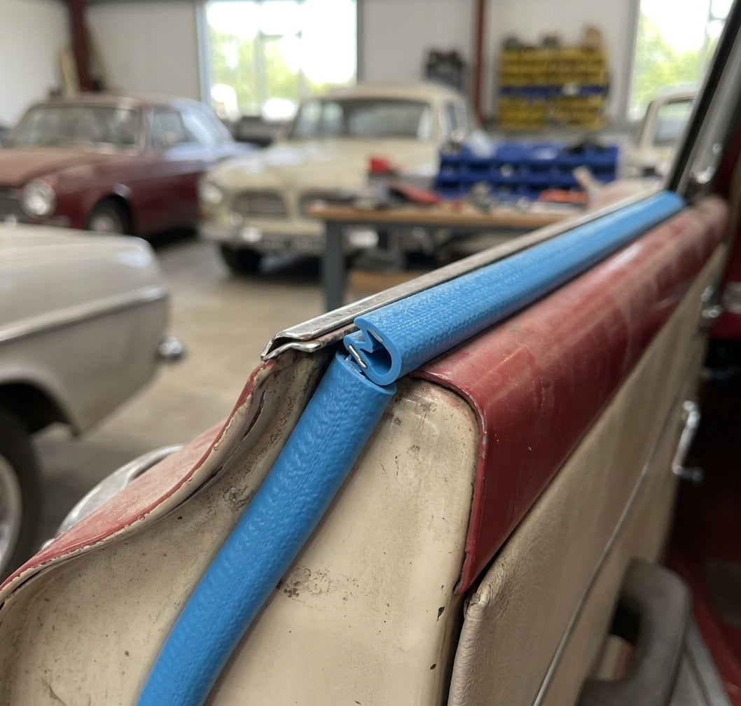 Blue PVC self grip edging strip fitted to the roof edge of a red and cream classic car