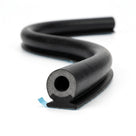 Black hollow sponge tube with a finned mounting foot and blue adhesive tape, coiled length