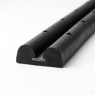 Black double-D fender profile with pre-drilled fixing holes, stainless steel insert strip visible at the base