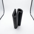 Black neoprene U-channel with flange, standing hook-shaped profile on white background