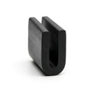 Black EPDM U-channel trim standing upright, plain white background shot of rounded block