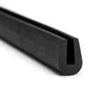 Black EPDM U-channel trim profile coiled, close-up view of rounded groove