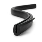 Black EPDM channel section shown as S-curved coiled length, extending tail profile visible